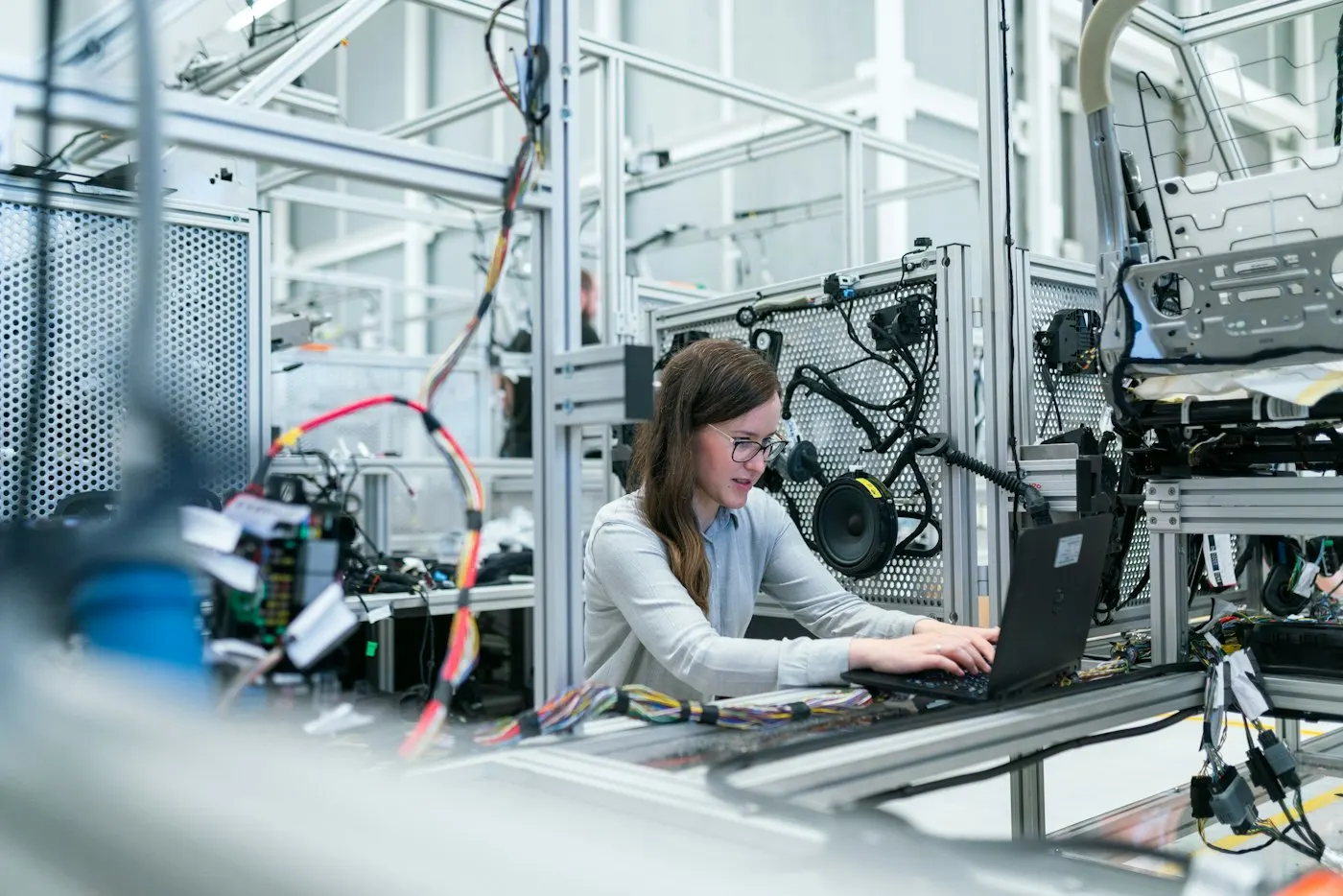 Engineer working on industrial equipment in a technical facility